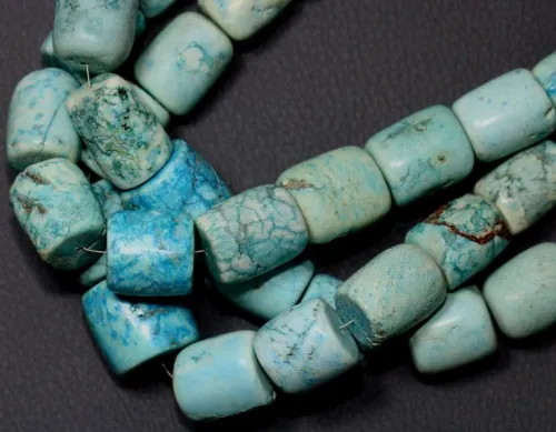 Comparison of UX turquoise badge vs ceremonial dagger