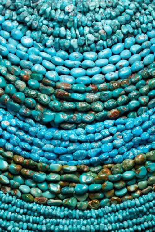 Side-by-side swatches showing teal and turquoise gradients on fabric