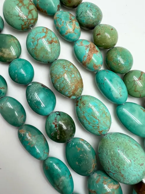 Turquoise fabric under different lighting conditions showing shade variations